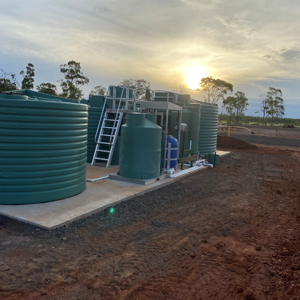 Rural water treatment and tank installation by Roma Plumbing in Roma QLD during sunset